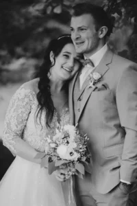 a man and woman posing for a picture black white
