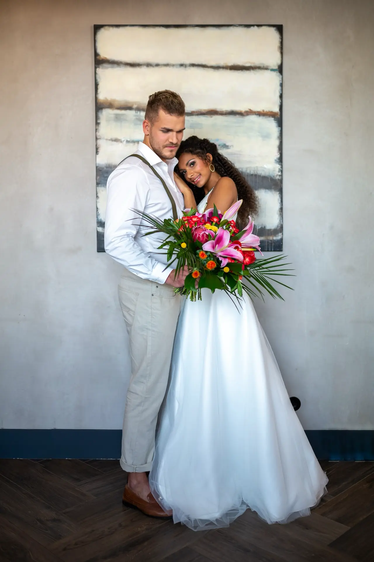 a man and woman holding flowers